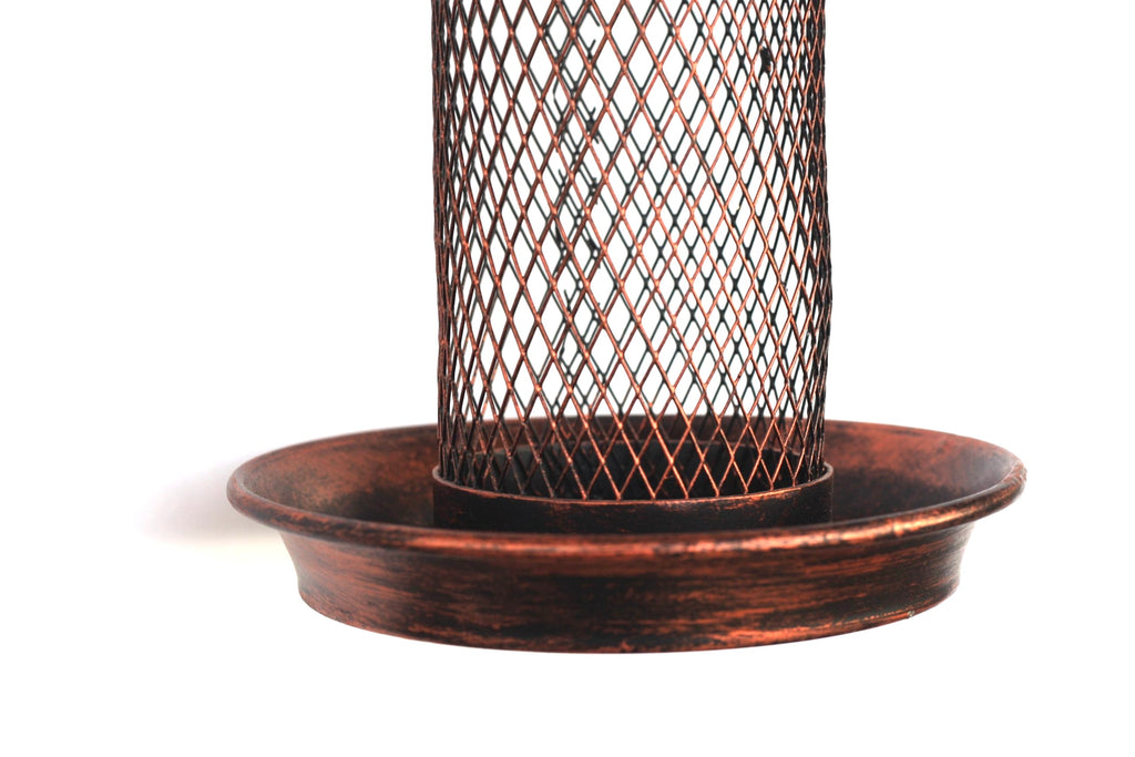A copper bird feeder with a cylindrical wire mesh cage and a matching shallow round tray, shown against a plain white background.