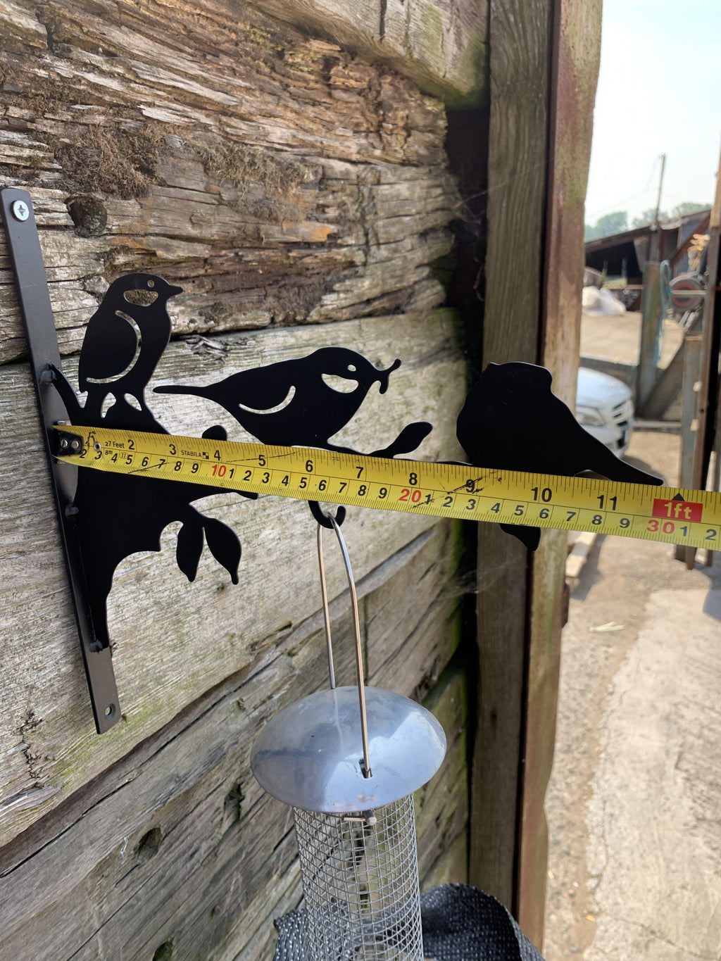 measuring a birdfeeder hanger to show the size and quality uk bird feeder