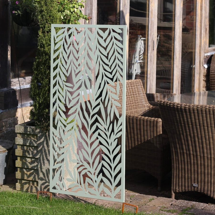Steel garden ornament in a garden border