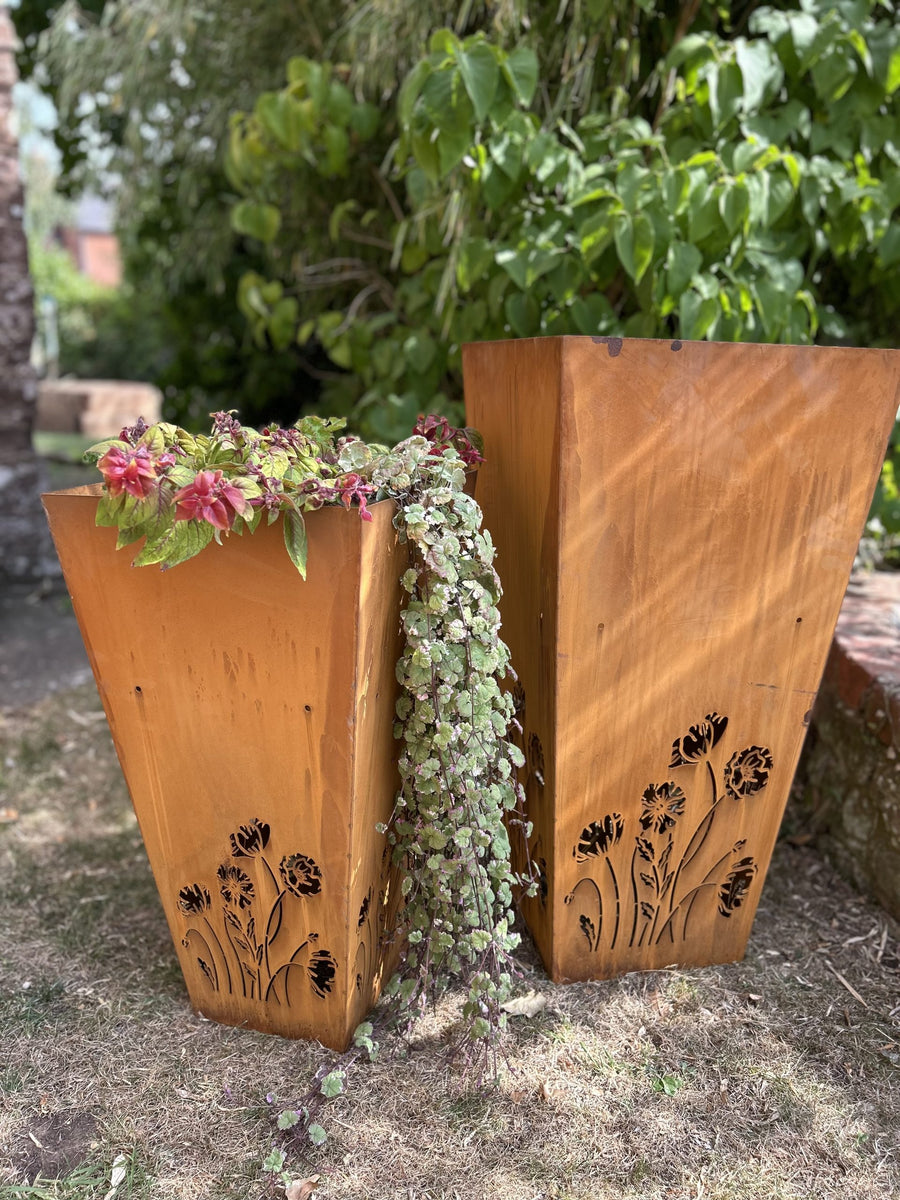 laser cut premium steel corten large planters with trailing plants in garden setting