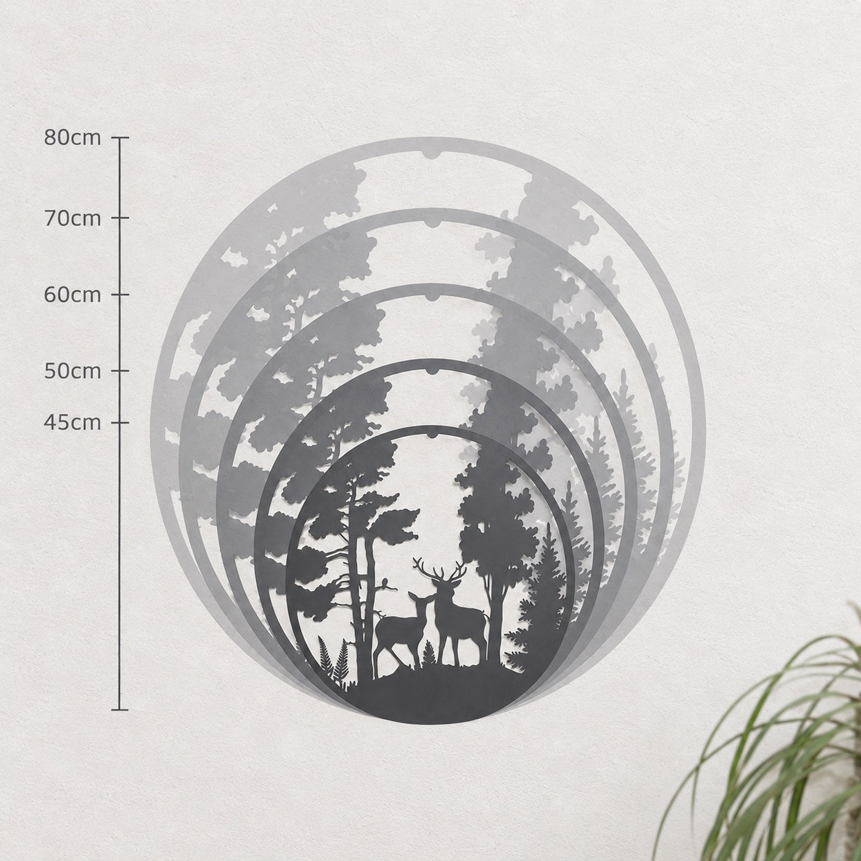 Wall art in five sizes, from 45cm to 80cm, layered on a white wall